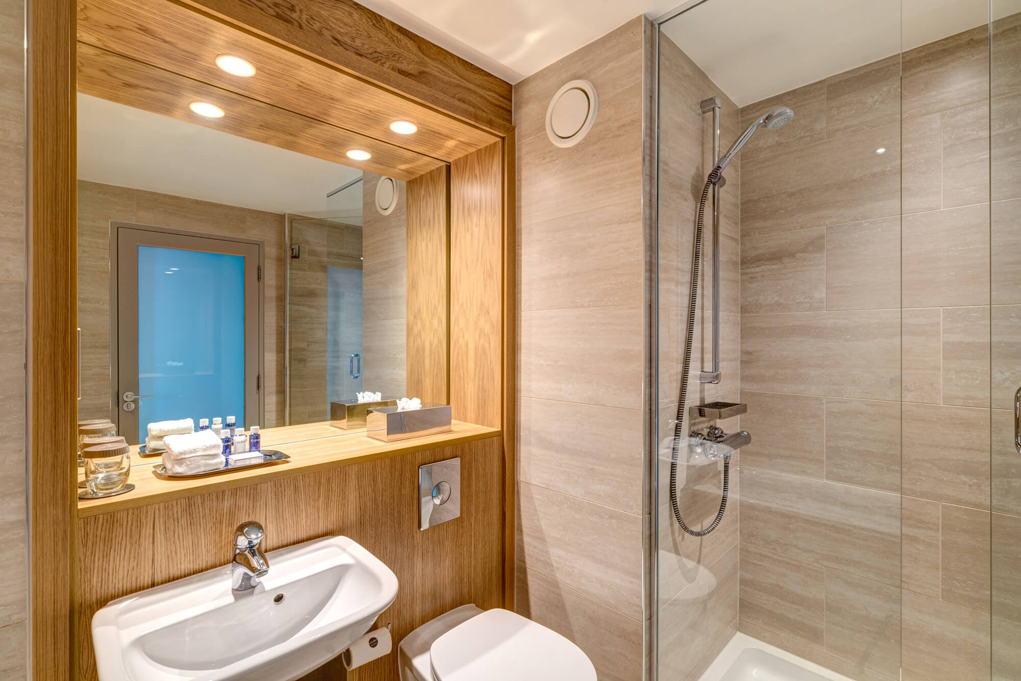 Walk-in shower and sink with mirror